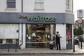 British police arrest a man over infusing food at three London stores.