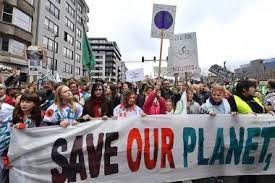 Thousands of people marched through Brussels to urge more aggressive climate action.