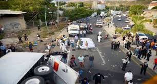 A truck smuggling migrants crashes in Mexico, killing 53 people.